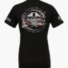 Rebellious pirate-style, black T-shirt with distressed American flag, skull and crossed swords, and the quote When Tyranny Becomes Law Rebellion Becomes Duty.