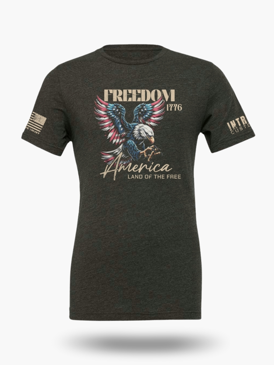 Dark heather grey t-shirt displaying an eagle and "America Land of the Free Home of the Brave" and "Freedom Since 1776" text