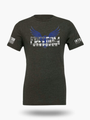 Dark Heather Grey t-shirt featuring a bold eagle with outstretched wings and the text "FREEDOM UNBROKEN" in a distressed font, with an American flag patch on the sleeve.