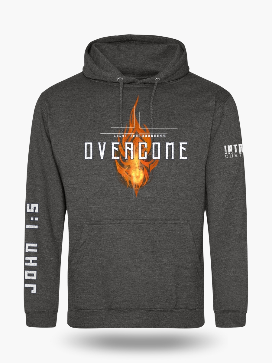 Charcoal hoodie with a vibrant orange flame design and the text "OVERCOME - LIGHT THE DARKNESS" on the front, and "JOHN 1:5" in bold white font running down the right sleeve.