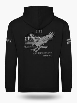 Patriotic graphic featuring the text ‘Life, Liberty & the Pursuit of Happiness’ over a distressed American flag with an eagle silhouette on a black hoodie.