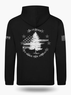 Black hoodie with Appeal to Heaven flag design featuring a bold White Pine Tree over a distressed American flag background. Historic patriotic graphic with strong revolutionary symbolism.