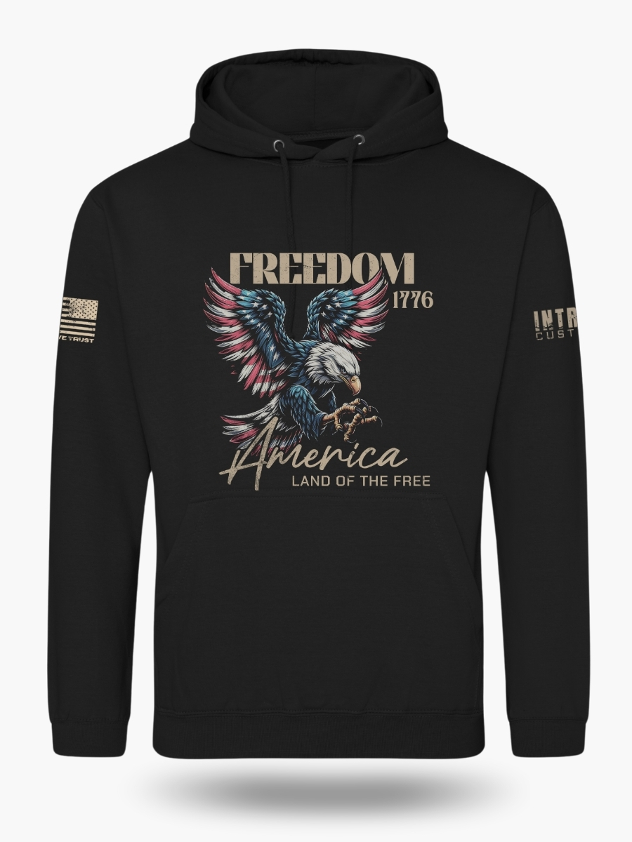 Front of black hoodie displaying a bold American flag bald eagle graphic with the wording &acirc;Freedom 1776&acirc; and &acirc;America &acirc; Land of the Free.&acirc; Premium patriotic hoodie.